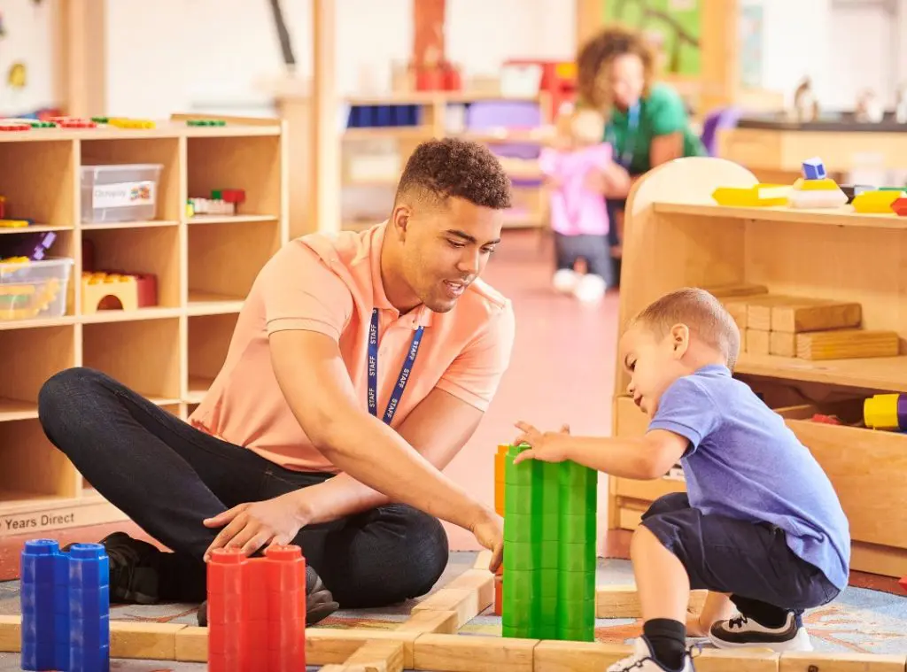 Early childhood educator playing with kids